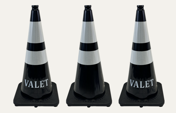 Picture of three black cones with two reflective collars. Two of them say Valet.