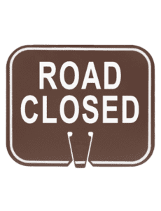 Picture with brown clip on signs with the legend "Road Closed" in white ink.